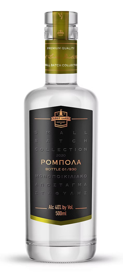 Lost Lake Distillery Robola bottle with label, showcasing the spirit's unique design and amber liquid against a neutral background.